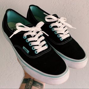 Black vans with light blue details